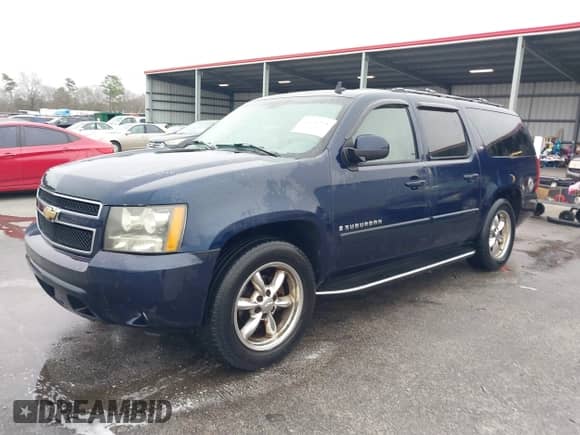 2007 Chevrolet Suburban LT z VIN 1GNFC16067R276582, wystawiony jako IAAI lot #41494768 z przebiegiem 300 791 mil mil oraz . Historia ofert i sprzedaży dostępna na DreamBid. Obrazek 2.