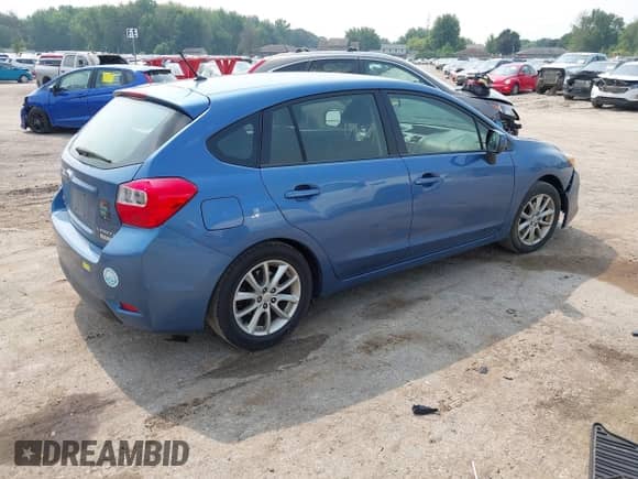 2014 Subaru Impreza Premium with VIN JF1GPAC63E8242702, listed as a IAAI auction lot 42896782 with 153,521 mi miles and . Bid and sale history available at DreamBid. Image 4.