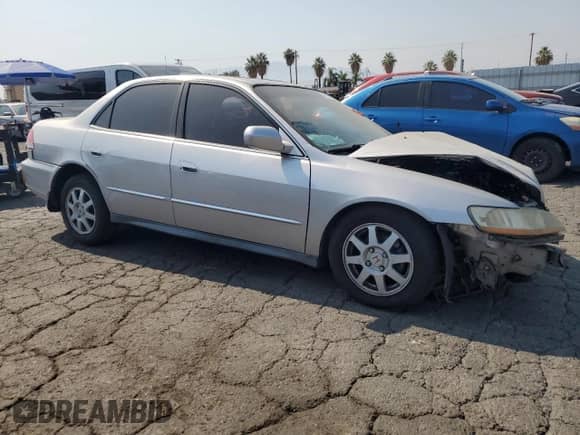 2002 Honda Accord SE with VIN 1HGCG66892A112982, listed as a Copart auction lot 64790505 with 135,396 mi miles and Salvage title. Bid and sale history available at DreamBid. Image 4.