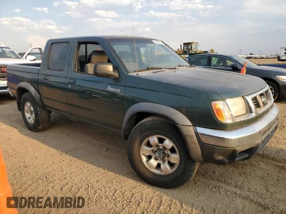 2000 Nissan Frontier XE with VIN 1N6ED27Y9YC425953, listed as a Copart auction lot 68830265 with 317,976 mi miles and Clean title. Bid and sale history available at DreamBid. Image 4.