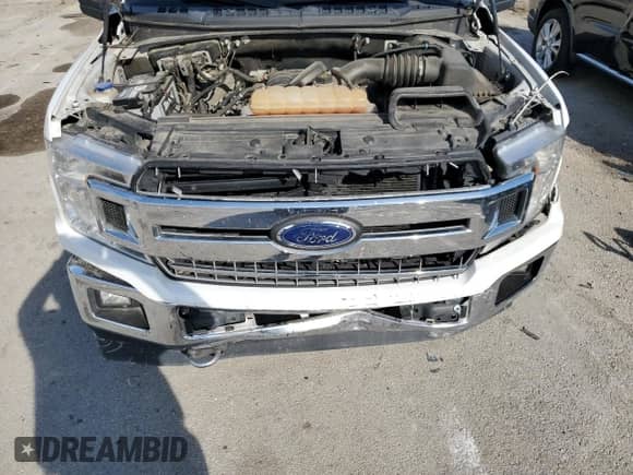 2018 Ford F-150 XL with VIN 1FTEW1E58JFE75389, listed as a Copart auction lot 70952815 with 109,135 mi miles and Salvage title. Bid and sale history available at DreamBid. Image 11.