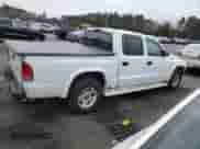 2003 Dodge Dakota Sport with VIN 1D7HL38X23S325843, listed as a Copart auction lot 47229595 with 248,467 mi miles and Salvage title. Bid and sale history available at DreamBid. Image 3.