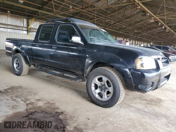 2003 Nissan Frontier SVE with VIN 1N6MD29Y13C412289, listed as a Copart auction lot 49092815 with 192,429 mi miles and Clean title. Bid and sale history available at DreamBid. Image 4.