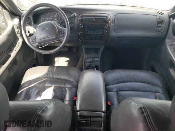 1999 Ford Explorer XLT with VIN 1FMZU34E1XZA28197, listed as a Copart auction lot 58852855 with 115,367 mi miles and Salvage title. Bid and sale history available at DreamBid. Image 8.