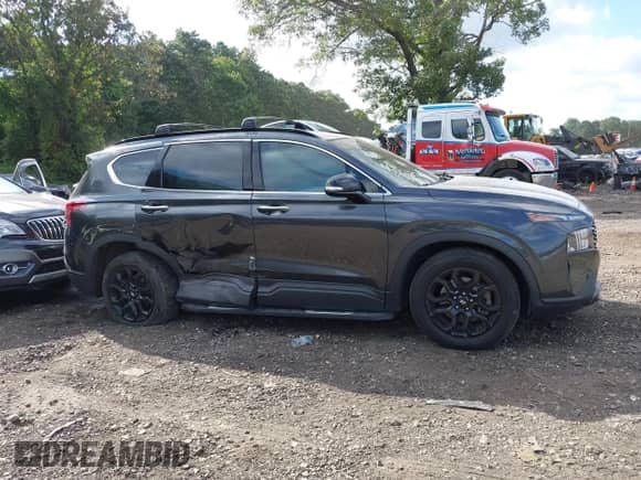 2022 Hyundai Santa Fe XRT with VIN 5NMS64AJ8NH428704, listed as a IAAI auction lot 43082726 with 50,307 mi miles and . Bid and sale history available at DreamBid. Image 13.