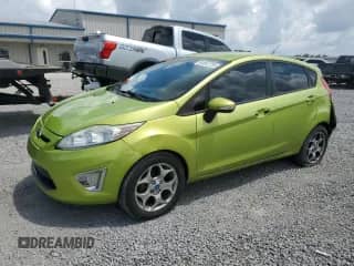 2012 Ford Fiesta SES with VIN 3FADP4FJ2CM103917, listed as a Copart auction lot 64542735 with 215,504 mi miles and Salvage title. Bid and sale history available at DreamBid. Image 1.