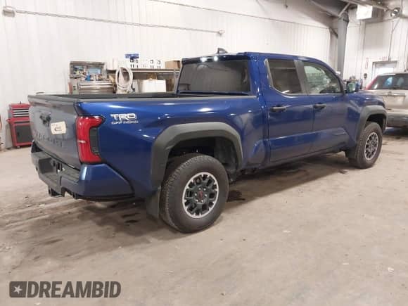 2024 Toyota Tacoma SR5 with VIN 3TMLB5JN3RM054207, listed as a IAAI auction lot 41171946 with 3,808 mi miles and . Bid and sale history available at DreamBid. Image 4.