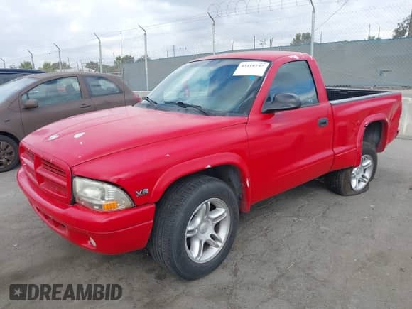 1999 Dodge Dakota SLT with VIN 1B7GL26Z5XS217114, listed as a IAAI auction lot 43418147 with 145,280 mi miles and . Bid and sale history available at DreamBid. Image 2.