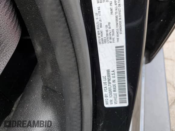 2023 Ram 1500 Rebel with VIN 1C6SRFLT9PN590999, listed as a Copart auction lot 63325355 with 82,896 mi miles and Salvage title. Bid and sale history available at DreamBid. Image 12.