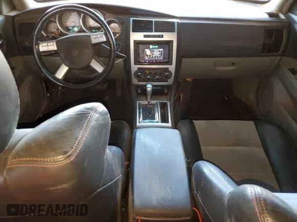 2006 Dodge Charger SRT-8 с VIN 2B3KA73W16H385931, выставлен на аукционе Copart как лот 57815795 с пробегом 125 706 миль миль и Списание • Salvage title. История ставок и продаж доступна на DreamBid. Изображение 8.