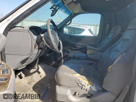 1997 Ford F-150 XL with VIN 1FTDF07WXVKA53293, listed as a Copart auction lot 84745555 with 164,151 mi miles and Salvage title. Bid and sale history available at DreamBid. Image 7.