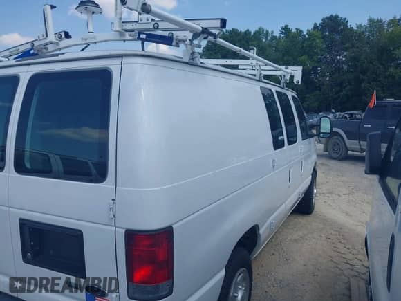 2014 Ford Econoline Cargo Commercial with VIN 1FTNE1EW4EDB15338, listed as a IAAI auction lot 42530382 with 185,886 mi miles and . Bid and sale history available at DreamBid. Image 4.
