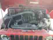 1999 Jeep Wrangler Sport with VIN 1J4FY19S8XP427144, listed as a Copart auction lot 84555815 with 178,100 mi miles and Salvage title. Bid and sale history available at DreamBid. Image 11.