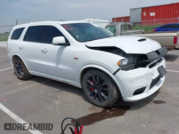 2018 Dodge Durango SRT with VIN 1C4SDJGJ2JC434843, listed as a IAAI auction lot 42434327 with 144,483 mi miles and . Bid and sale history available at DreamBid. Image 1.