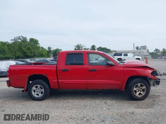 2005 Dodge Dakota SLT z VIN 1D7HE48N95S101910, wystawiony jako IAAI lot #42873247 z przebiegiem 198 794 mil mil oraz . Historia ofert i sprzedaży dostępna na DreamBid. Obrazek 14.