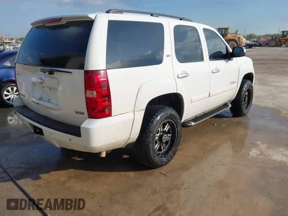 2007 Chevrolet Tahoe LT with VIN 1GNFC13067R411063, listed as a IAAI auction lot 43364553 with 244,866 mi miles and . Bid and sale history available at DreamBid. Image 4.