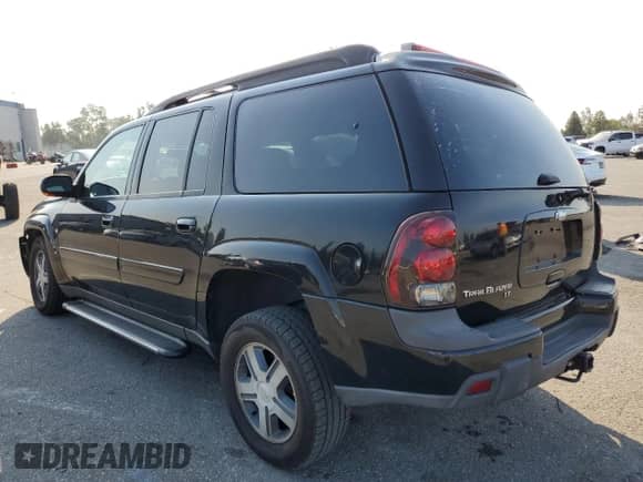 2005 Chevrolet TrailBlazer LT with VIN 1GNES16SX56180758, listed as a Copart auction lot 64701205 with 151,000 mi miles and Salvage title. Bid and sale history available at DreamBid. Image 2.