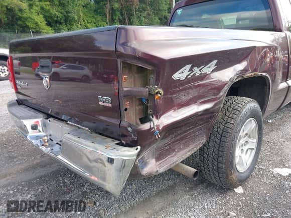 2005 Dodge Dakota SLT with VIN 1D7HW42N95S133844, listed as a IAAI auction lot 42896659 with 121,256 mi miles and . Bid and sale history available at DreamBid. Image 12.