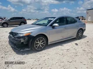 2023 Toyota Camry Hybrid XLE with VIN 4T1F31AK2PU608138, listed as a Copart auction lot 61400515 with 13,504 mi miles and Salvage title. Bid and sale history available at DreamBid. Image 1.
