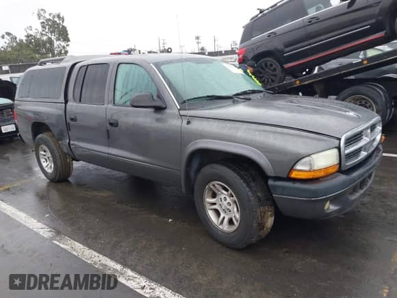 2004 Dodge Dakota Sport z VIN 1D7HL38N94S651302, wystawiony jako IAAI lot #41504334 z przebiegiem Nie podano mil oraz . Historia ofert i sprzedaży dostępna na DreamBid. Obrazek 1.