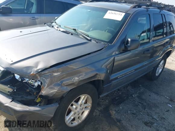 2003 Jeep Grand Cherokee Laredo z VIN 1J4GX48S63C578270, wystawiony jako IAAI lot #42656724 z przebiegiem 216 000 mil mil oraz . Historia ofert i sprzedaży dostępna na DreamBid. Obrazek 2.