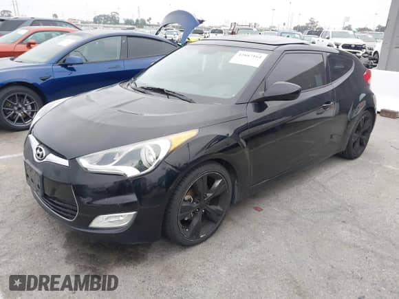 2015 Hyundai Veloster with VIN KMHTC6AD4FU240867, listed as a IAAI auction lot 42887164 with 94,620 mi miles and . Bid and sale history available at DreamBid. Image 2.