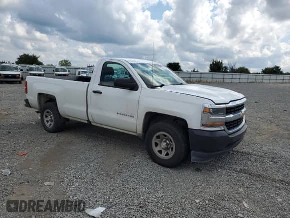 2017 Chevrolet Silverado 1500 Work Truck with VIN 1GCNCNEH3HZ329906, listed as a Copart auction lot 57753035 with 394,211 mi miles and Salvage title. Bid and sale history available at DreamBid. Image 4.