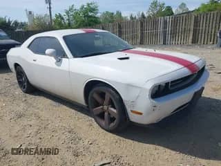 2013 Dodge Challenger SXT с VIN 2C3CDYAG3DH520016, выставлен на аукционе IAAI как лот 42117942 с пробегом 150 463 миль миль и . История ставок и продаж доступна на DreamBid. Изображение 1.
