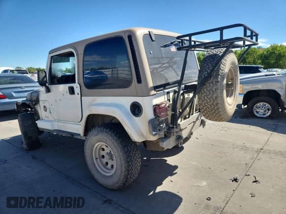 1999 Jeep Wrangler Sahara с VIN 1J4FY49S4XP411704, выставлен на аукционе Copart как лот 71826235 с пробегом Не указан миль и Списание • Salvage title. История ставок и продаж доступна на DreamBid. Изображение 2.