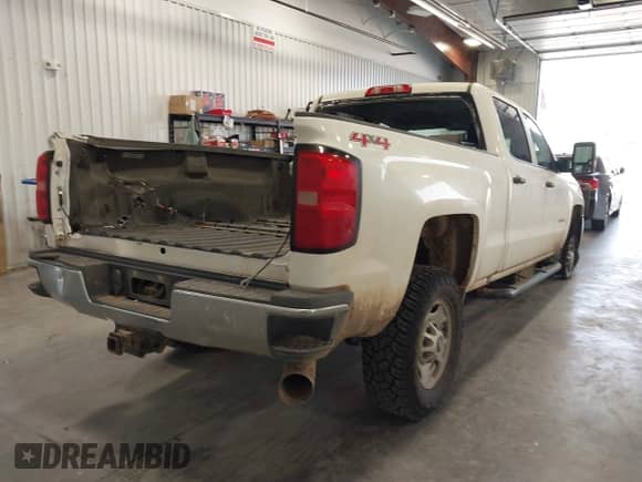 2016 Chevrolet Silverado 2500HD Work Truck with VIN 1GC1KUE80GF124569, listed as a IAAI auction lot 42915578 with 115,052 mi miles and . Bid and sale history available at DreamBid. Image 4.