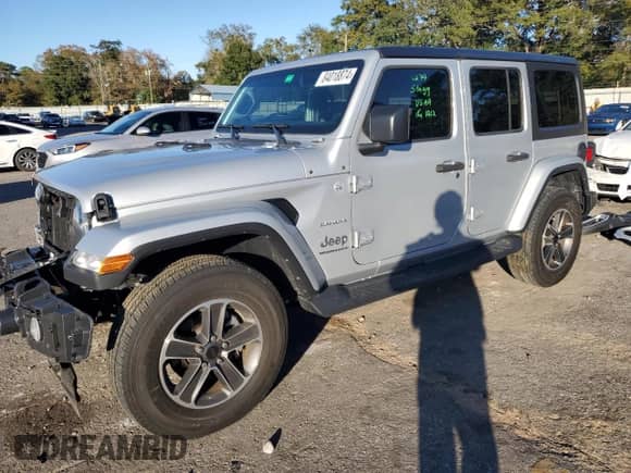 2023 Jeep Wrangler Sahara Altitude with VIN 1C4HJXEG1PW601584, listed as a Copart auction lot 84018874 with 12,003 mi miles and Salvage title. Bid and sale history available at DreamBid. Image 1.