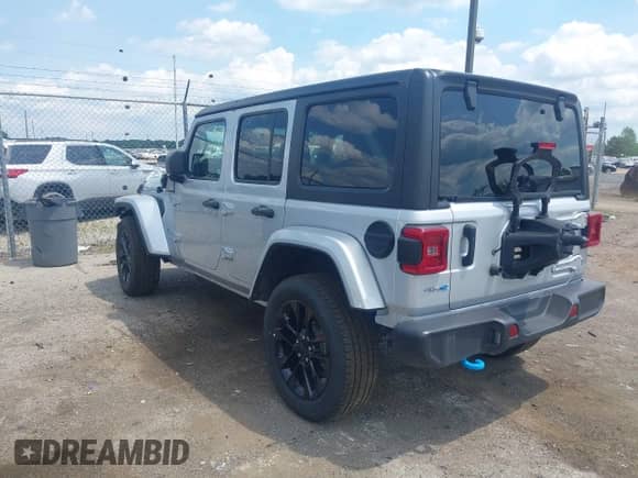 2023 Jeep Wrangler Sahara with VIN 1C4JJXP69PW695915, listed as a IAAI auction lot 42662028 with 36,957 mi miles and . Bid and sale history available at DreamBid. Image 3.