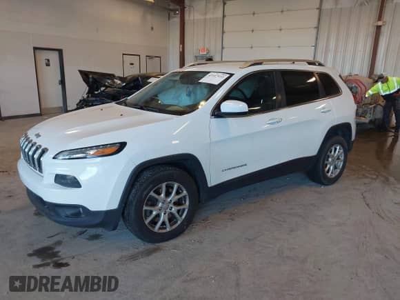 2014 Jeep Cherokee Latitude with VIN 1C4PJMCS8EW198735, listed as a IAAI auction lot 43107933 with 151,394 mi miles and . Bid and sale history available at DreamBid. Image 2.