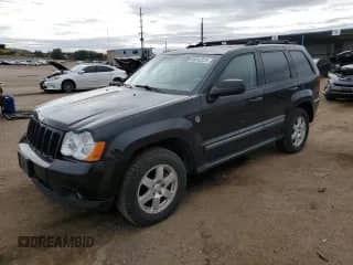 2009 Jeep Grand Cherokee Laredo with VIN 1J8HR48P59C520958, listed as a Copart auction lot 86542225 with 199,307 mi miles and Clean title. Bid and sale history available at DreamBid. Image 1.