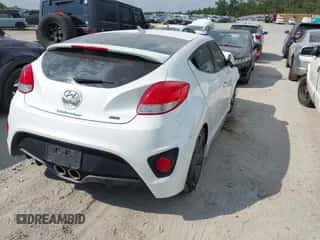 2014 Hyundai Veloster Turbo z VIN KMHTC6AE8EU195925, wystawiony jako IAAI lot #43149493 z przebiegiem 156 100 mil mil oraz . Historia ofert i sprzedaży dostępna na DreamBid. Obrazek 4.