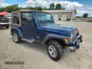 2003 Jeep Wrangler X z VIN 1J4FA39S33P356428, wystawiony jako Copart lot #70285135 z przebiegiem 147 788 mil mil oraz Szkoda całkowita • Salvage title. Historia ofert i sprzedaży dostępna na DreamBid. Obrazek 4.