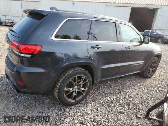 2014 Jeep Grand Cherokee SRT-8 z VIN 1C4RJFDJ2EC198810, wystawiony jako Copart lot #84599495 z przebiegiem 135 251 mil mil oraz Czysty tytuł • Clean title. Historia ofert i sprzedaży dostępna na DreamBid. Obrazek 3.