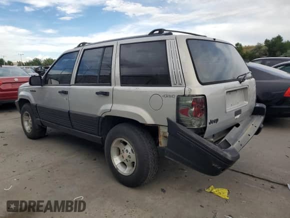1995 Jeep Grand Cherokee Laredo with VIN 1J4GZ58S2SC703196, listed as a Copart auction lot 68571944 with 264,876 mi miles and Clean title. Bid and sale history available at DreamBid. Image 2.