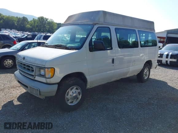 2002 Ford Econoline Cargo with VIN 1FTNE242X2HA90857, listed as a IAAI auction lot 42716391 with 103,796 mi miles and . Bid and sale history available at DreamBid. Image 2.