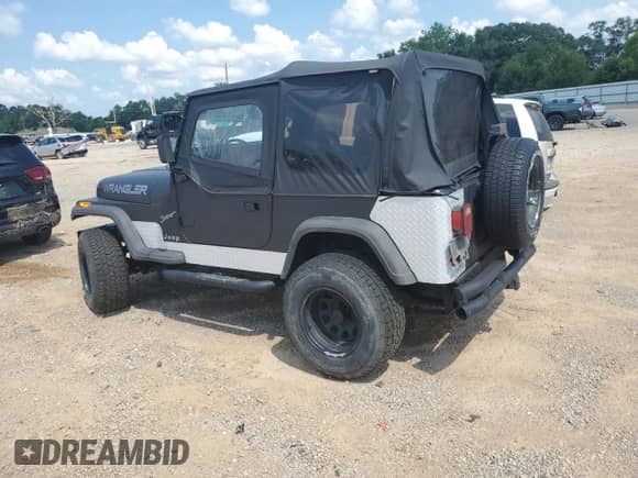 1995 Jeep Wrangler S with VIN 1J4FY19PXSP214216, listed as a Copart auction lot 68661775 with 129,815 mi miles and Salvage title. Bid and sale history available at DreamBid. Image 2.