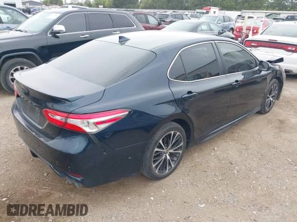 2020 Toyota Camry SE with VIN 4T1G11AK4LU955992, listed as a IAAI auction lot 43027088 with 77,002 mi miles and . Bid and sale history available at DreamBid. Image 4.