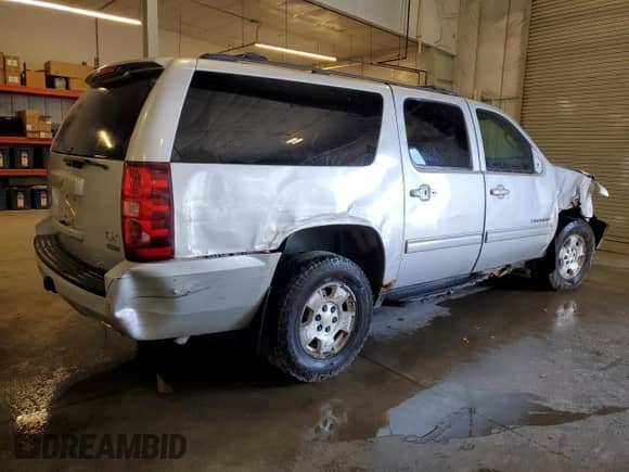 2011 Chevrolet Suburban LS with VIN 1GNSKHE37BR166073, listed as a Copart auction lot 65434585 with 145,957 mi miles and Salvage title. Bid and sale history available at DreamBid. Image 3.