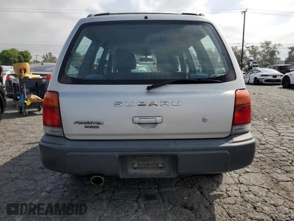 1999 Subaru Forester L with VIN JF1SF6353XH727555, listed as a Copart auction lot 80185275 with 186,950 mi miles and Salvage title. Bid and sale history available at DreamBid. Image 6.