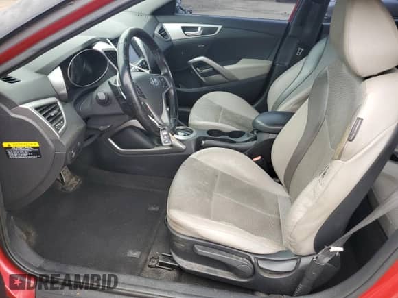 2014 Hyundai Veloster z VIN KMHTC6AD0EU196106, wystawiony jako Copart lot #69494305 z przebiegiem 102 472 mil mil oraz Szkoda całkowita • Salvage title. Historia ofert i sprzedaży dostępna na DreamBid. Obrazek 7.