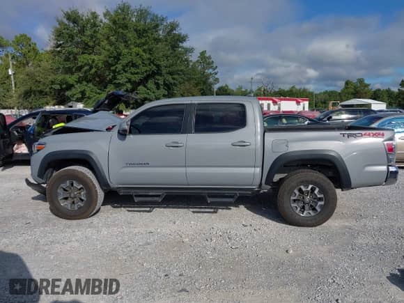 2021 Toyota Tacoma SR with VIN 3TYCZ5ANXMT024937, listed as a IAAI auction lot 43314888 with 77,580 mi miles and . Bid and sale history available at DreamBid. Image 14.