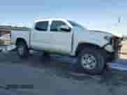 2023 Toyota Tacoma SR z VIN 3TMCZ5ANXPM645403, wystawiony jako Copart lot #84790665 z przebiegiem 81 279 mil mil oraz Szkoda całkowita • Salvage title. Historia ofert i sprzedaży dostępna na DreamBid. Obrazek 4.