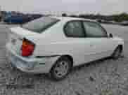 2004 Hyundai Accent GL z VIN KMHCG35C14U311640, wystawiony jako Copart lot #78511284 z przebiegiem 175 004 mil mil oraz Szkoda całkowita • Salvage title. Historia ofert i sprzedaży dostępna na DreamBid. Obrazek 3.