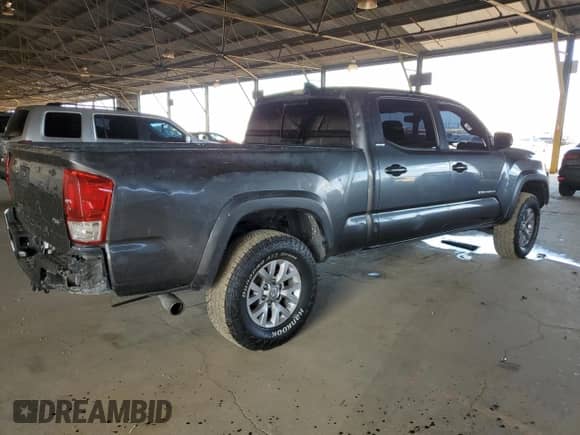 2018 Toyota Tacoma SR5 z VIN 3TMBZ5DNXJM016299, wystawiony jako Copart lot #64479535 z przebiegiem 87 574 mil mil oraz Czysty tytuł • Clean title. Historia ofert i sprzedaży dostępna na DreamBid. Obrazek 3.