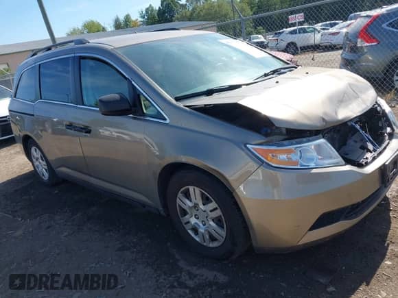2013 Honda Odyssey LX with VIN 5FNRL5H27DB017516, listed as a IAAI auction lot 43245571 with 141,666 mi miles and . Bid and sale history available at DreamBid. Image 1.