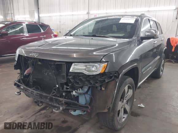 2015 Jeep Grand Cherokee Overland with VIN 1C4RJFCG8FC769112, listed as a IAAI auction lot 42513573 with 147,874 mi miles and . Bid and sale history available at DreamBid. Image 2.
